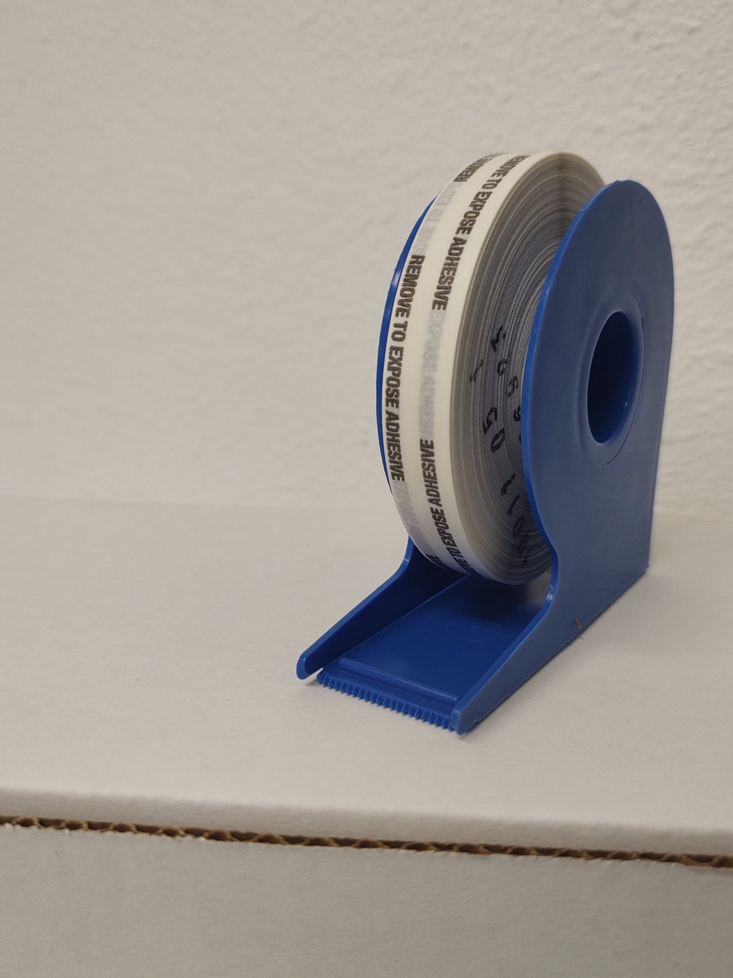 Heavy Duty Double Coated tissue tape w/Extended liner on a dispenser pack